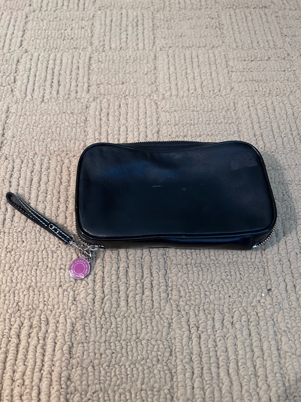COACH Black Leather Wristlet with Pink Charm Accent